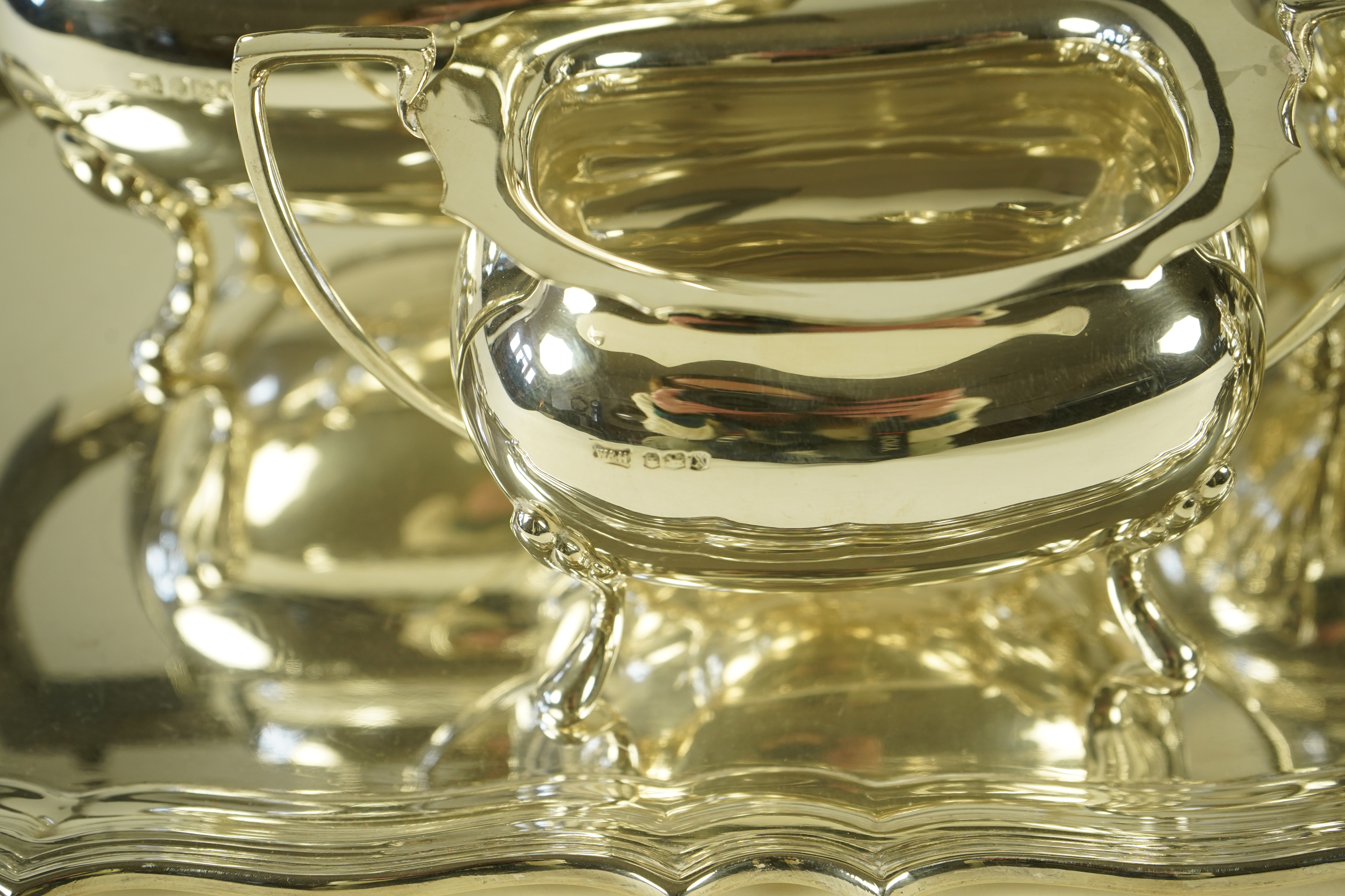 An Elizabeth II silver four piece tea service and two handled tea tray, by Walker & Hall